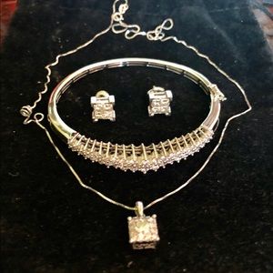 Set of diamond bracelet, earrings and necklace.